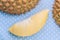 Mature Durian and durian shell on blue polka dots background.