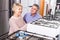 Mature family couple choose to themselves gas stove