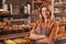 Mature female baker working at her bakery store