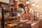 Mature female baker working at her bakery store