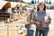 Mature female milker posing with glass of milk