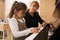 Mature female musician, a music teacher, pianist explaining to a little kid girl student music lesson