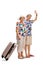 Mature female tourist with suitcase and mature male tourist waving