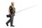 Mature fisherman walking with a fishing rod and a box