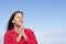 Mature friendly woman Meditating and praying