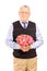 A mature gentleman holding bouquet of flowers