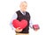 Mature gentleman holding a red heart and gift