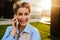 Mature grey woman laughing while talking on mobile phone