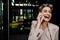 Mature grey woman laughing while talking on mobile phone