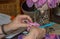 Mature hands doing crochure needlework