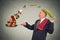 Mature happy businessman cooking vegetables with a pan