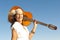 Mature hippie woman with guitar