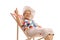 Mature lady seated in a deck chair making a thumb up sign