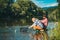 Mature man with adult son fishing. Fisher masculine hobby. Successful fly fishing. Cheerful mature fisherman fishing in