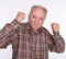 Mature man in boxer pose with raised fists