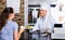 Mature man chef wearing uniform giving kebab plate to customer