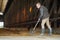 Mature Man Cleaning Farm