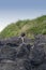 Mature Man climbing on Cliffs of Long Beach