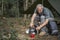 Mature man cooking at a campsite