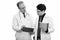 Mature man doctor holding clipboard with young man doctor holding digital tablet