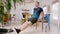 Mature man doing triceps dips using chair at home