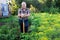 Mature man farmer posing in estate garden