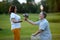 Mature man giving flowers bouquet to his excited wife.