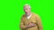 Mature man with heart attack, green screen.