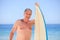 Mature man with his surfboard