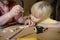 Mature man and little boy make a wooden toy together. Father learn his son work with tools.Traditional education of boy. Family`s