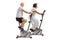 Mature man and a mature woman exercising on stationary bikes