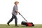 Mature man mowing a lawn