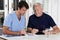 Mature Man playing Sudoku Puzzle