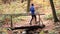 Mature man running on a cold morning in a colorful forest in fall or winte