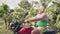 Mature man traveling on motorcycle in tropical countryside on green hills and rainforest landscape. Senior man