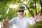 Mature man using virtual reality headset outdoor. VR, VR glasses, augmented reality experience