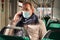 Mature man wearing protective mask sitting at the train and having conversation