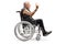 Mature man in a wheelchair making a rock and roll hand sign