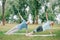 Mature man and woman doing side plank exercise while practicing yoga on lawn in park