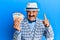 Mature middle east man with mustache wearing elegant vintage style holding euros banknotes smiling with an idea or question