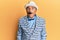 Mature middle east man with mustache wearing vintage and elegant fashion style making fish face with lips, crazy and comical