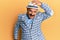 Mature middle east man with mustache wearing vintage and elegant fashion style surprised with hand on head for mistake, remember