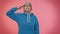 Mature old grandmother giving salute listening to order as if soldier, following discipline, obeying