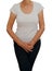 Mature, older woman holding crotch. Discomfort from incontinence, menopause or similar personal problem. White background