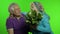 Mature senior old couple. Grandfather gives bouquet of flowers to grandmother