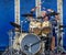 Mature silver haired drummer - action shot taken in Chippenham Park, Wiltshire, UK