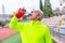 Mature sportive man drinking water after running in a track
