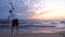 Mature sportsman doing morning exercise at sunrise over the sea