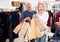 Mature spouses carrying bags with purchases