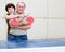 Mature spouses playing table tennis